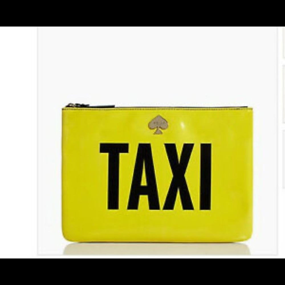 Kate Spade New York new taxi clutch purse.